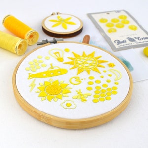 Yellow rainbow hoop, a fun embroidery pattern filled with miniatures from life and popular culture