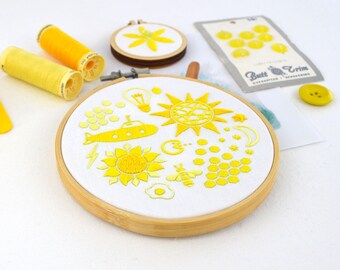 Yellow rainbow hoop, a fun embroidery pattern filled with miniatures from life and popular culture