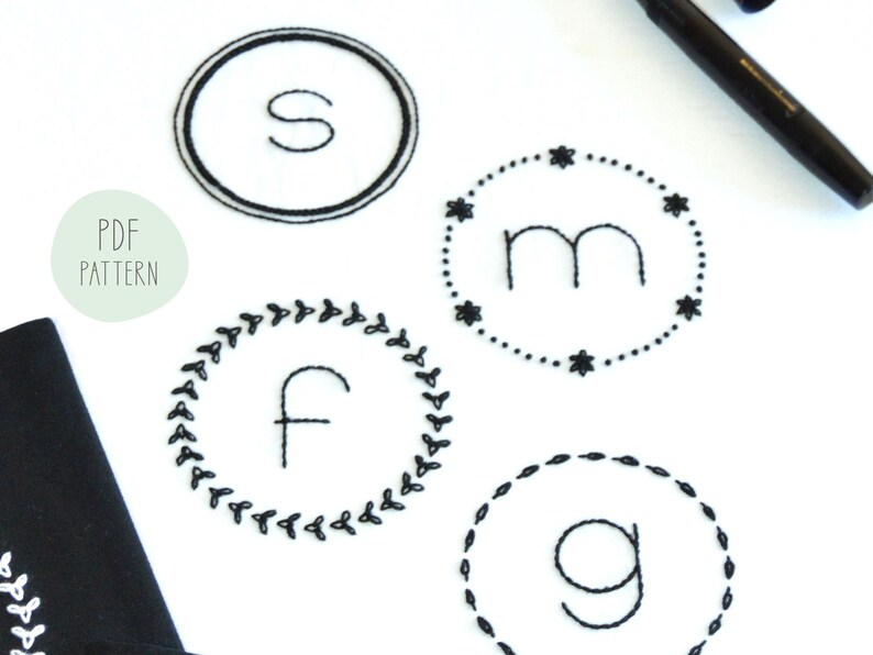 May include: A PDF pattern for embroidery designs featuring four different monogram initials: S, M, F, and G. Each initial is surrounded by a unique decorative border.