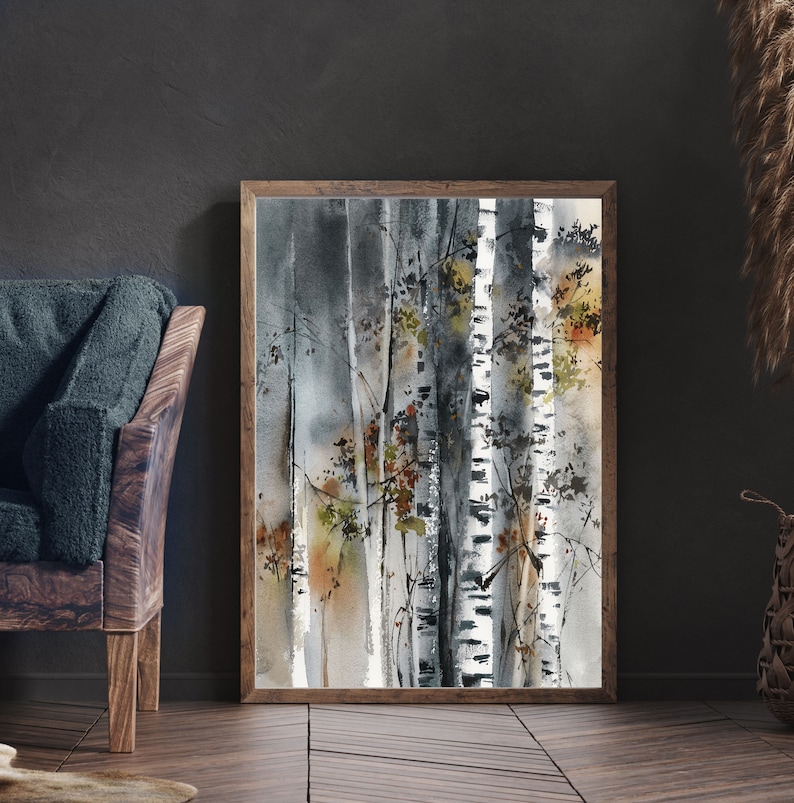May include: Watercolor painting of birch trees in a wooden frame. The artwork features a muted color palette of gray, white, and brown, with touches of orange and green. The painting depicts a forest scene with vertical tree trunks.