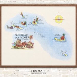 May include: A framed vintage pictorial map of the Azores Islands, with illustrations of local scenes. The map includes the text "ARQUIPELAGO DOS ACORES" and "FUN MAPS". The map is in a wooden frame.