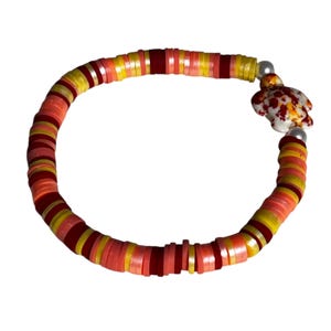 Burnt orange/yellow/ peach  colored Heishi Beaded Sea Turtle stretch bracelet