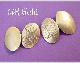 May include: Four 14K gold cufflinks, two with engraved initials and two plain. The cufflinks are oval shaped and have a polished finish.