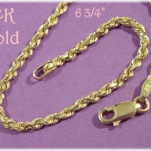 May include: A 14K gold rope chain bracelet, 6 3/4 inches long. The bracelet has a lobster clasp.