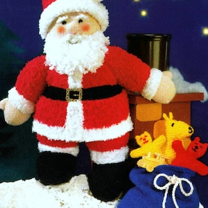 May include: A knitted Santa Claus doll with a white beard and red and white suit. He is holding a blue bag with a white drawstring and a few stuffed animals. The background is a dark blue with white stars.
