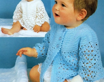 May include: Two photos of a baby wearing a crocheted baby cardigan. The first photo shows the baby wearing a white cardigan. The second photo shows the baby wearing a light blue cardigan.