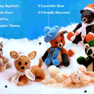 May include: A collection of crocheted animal toys, including a squirrel, deer, fox, bunny, bear, and raccoon. Each toy is wearing a scarf and hat, and they are all sitting on a snowy background.