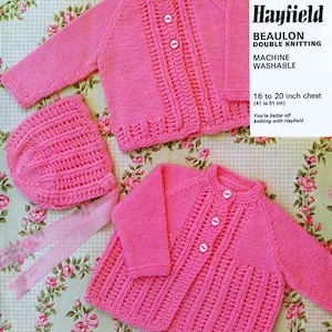 May include: A pink knitted baby cardigan and matching hat with buttons. The yarn is a double knit, machine washable, and made by Hayfield Beaulon.