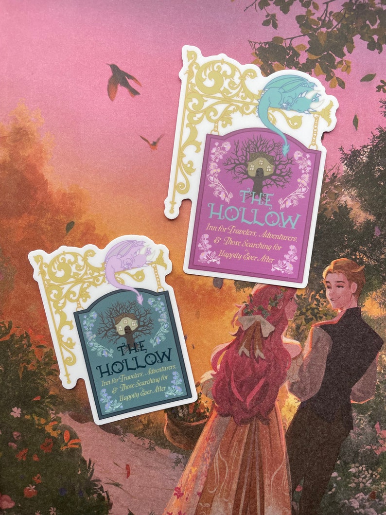 May include: Two stickers featuring a whimsical sign with a dragon and the text "The Hollow Inn for Travelers, Adventurers, & Those Searching for Happily Ever After". The sign is on a purple background with a gold frame. The stickers are on a pink and orange background with a couple standing in the foreground.