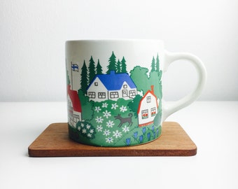 Arabia Finland ceramic mug by Gunvor Olin-Grönqvist and ceramic coffee cup hand painted by Esteri Tomula .