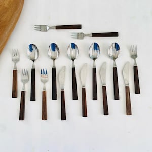 Beautiful modernist vintage rosewood /stainless steel cutlery sets Triennale. Designed Bertel Gardberg, made in Finland 1950s