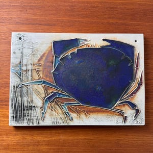 With signature handmade Arabia Finland ceramic art wall plaque with crab from “Kalat” series by artist Maj-Britt Heilimo, 1950s
