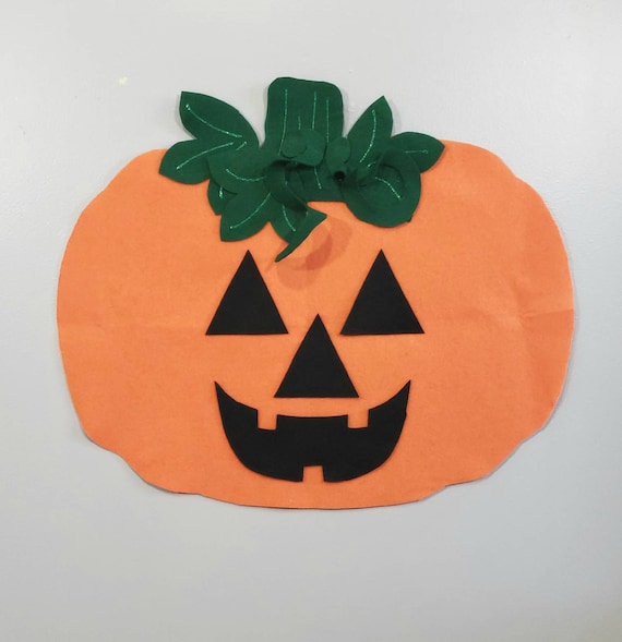 Carved Pumpkins, Smiling, on a Table Out of Doors Facing and Side