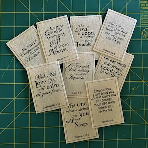 May include: A set of eight inspirational cards with bible verses printed on them. The cards are made of brown paper and have a rustic look. The verses are printed in black ink and are easy to read. The cards are perfect for adding a touch of faith to your home or office.