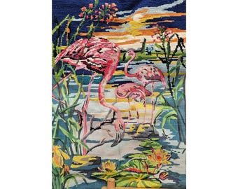 May include: A vintage tapestry featuring a serene scene with pink flamingos in a wetland setting. The artwork includes water lilies, reeds, and a sunset, with the text "MARGOT de Paris" at the top. The tapestry is mounted on a wooden frame.