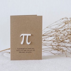 May include: A brown card with a white pi symbol and the text "I promise to love you until Pi has run out of decimal places."