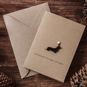 Teckel dans la neige / Saucisse / Chien Daxie / Carte de Noël de luxe