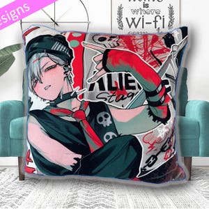 May include: A square throw pillow featuring a graphic anime-style illustration of a character with white hair, a black beanie, and a spiked collar. The design includes red and black accents, a skull motif, and the text ALIEN STAGE in bold lettering.
