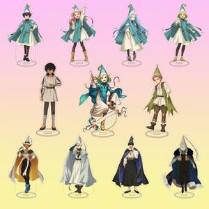 May include: A collection of eleven anime-style character acrylic standees featuring various figures in fantasy attire, including capes, pointed hats, and tunics, displayed on individual circular bases against a gradient background.