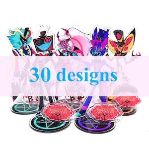 Op de afbeelding: Een verzameling karakter acryl stands met diverse kleurrijke ontwerpen. De stands hebben een heldere basis met een zwarte rand en een rood bord met de tekst "Hazbin Hotel". De afbeelding bevat de tekst "30 designs".