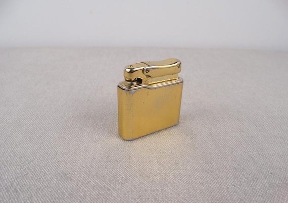 Accendino tascabile a braccio sollevabile Colibri originale svizzero, 1928