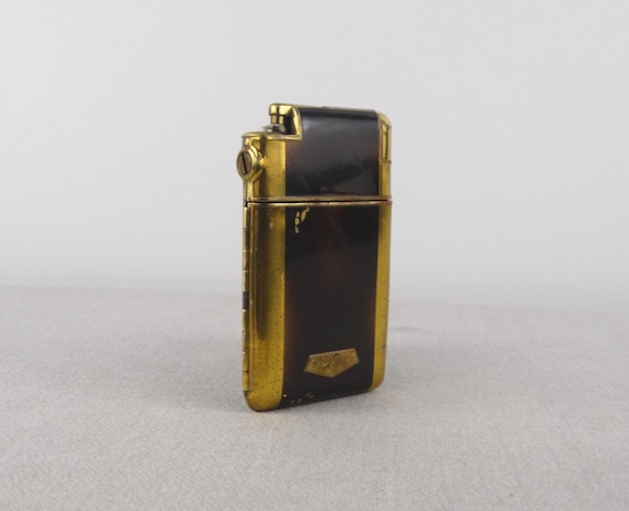 marathon cigarette case lighter A Marathon Slide-a-lite, with a nice art deco design and a protective leather wallet. More pictures in the comments marathon cigarette case lighter A Marathon Slide-a-lite, with a nice art deco design and a protective leather wallet. More pictures in the comments