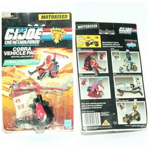 May include: A vintage G.I. Joe Cobra Gyrocoptor toy vehicle pack. The red and black toy helicopter has a pull-back motor and comes with a Cobra soldier figure. The packaging features the G.I. Joe logo and the words "Cobra Vehicle Pack" and "Cobra Gyrocoptor".