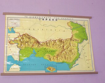 May include: A vintage map of Thrace, a region in Greece, with a brown wooden frame. The map is labeled "TA DIAMERISMA TA THS ELLADAS 4. THRAKH" and shows the surrounding countries of Bulgaria, Turkey, and the Aegean Sea.