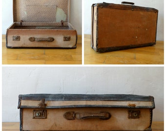 May include: Three vintage suitcases with brown leather exteriors and brass hardware. The suitcases have a worn and weathered look, suggesting they have been well-traveled.