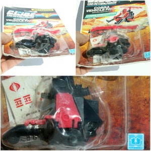 May include: A red and black Cobra Gyrocopter toy from the G.I. Joe: The Action Force toy line. The toy is in its original packaging and features a pull-back motor. The packaging includes the text "Cobra Vehicle Pack" and "Cobra Gyrocopter".