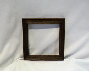 Tile panel with 4 ceramic tiles in a wooden frame.