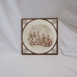 May include: A brown and white ceramic tile with a decorative border and a scene of a family in a room. The family is dressed in 19th-century clothing and is standing in a room with a fireplace and a window.