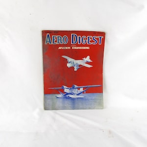 May include: Aero Digest magazine cover with a red background and the title in blue and white. The cover features illustrations of two airplanes. The magazine is dated November 1934 and includes the text "Aviation Engineering."