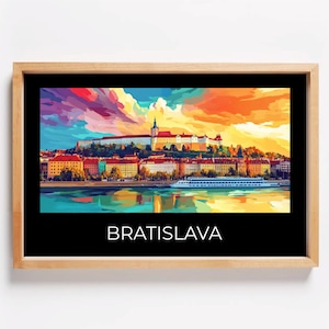 May include: A colorful painting of Bratislava, Slovakia, with a view of the city's castle and the Danube River. The painting is in a wooden frame and has the word "BRATISLAVA" printed at the bottom.