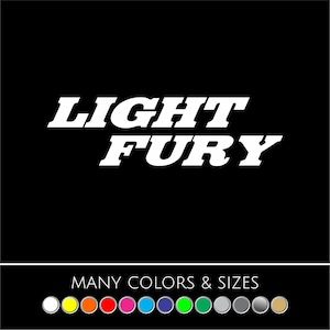 May include: A black background with the white text "LIGHT FURY" in a bold, stylized font. Below the text is the phrase "MANY COLORS & SIZES" with a color palette of circular icons.