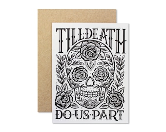 May include: Black and white illustration of a sugar skull with floral details. The text "Till Death Do Us Part" is written above and below the skull.