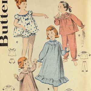 May include: Vintage Butterick sewing pattern for girls' sleepwear, size 3, with a breast measurement of 22 inches. The pattern features illustrations of various sleepwear designs, including a polka-dot romper, pajamas, and nightgowns. The pattern number is 8247.
