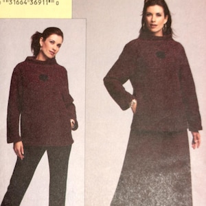May include: A sewing pattern package featuring a woman in a burgundy outfit. The package includes the text "7771 PATTERN/PATRON" and "TODAY'S FIT BY SANDRA BETZINA". The outfit includes a long-sleeved top and pants or a skirt.