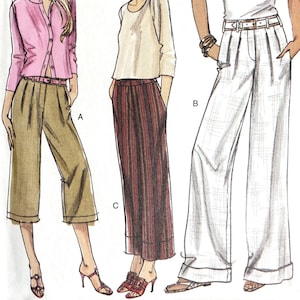 May include: A Very Easy Vogue sewing pattern, V8201, featuring illustrations of three different outfits. The pattern includes sizes EE (14-16-18-20). The outfits include a pink cardigan and khaki pants, a cream-colored top and striped skirt, and a white polo shirt and white pants.