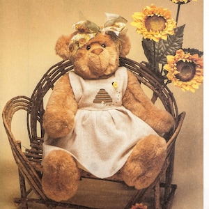 May include: A sewing pattern for a teddy bear sitting in a wicker chair. The pattern is from McCall's Crafts and is called "Little City Bears & Co." The pattern number is 8610.