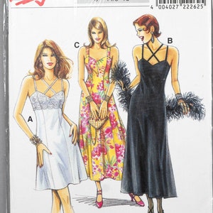 May include: A sewing pattern for three different dresses. The pattern is for sizes 34-44 and 8-18. The pattern number is 22262. The dresses are a white slip dress, a floral print dress, and a black dress with a criss-cross strap detail.
