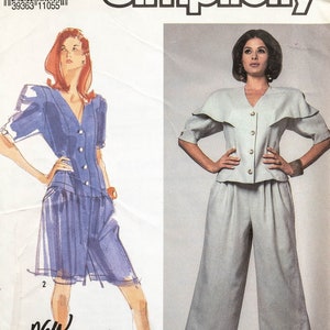 May include: Simplicity sewing pattern number 7156 for a women's top and pants. The pattern includes instructions for a collared top with a wide collar and a pair of wide-legged pants. The pattern is for sizes 8-14.