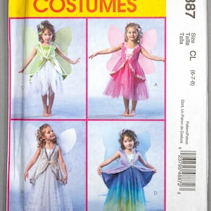 May include: A McCall's Costumes sewing pattern featuring four fairy costume designs for children. The cover has a yellow banner with the brand name and images of the costumes. The size is CL (6-7-8).