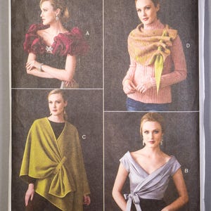 May include: Vogue Accessories sewing pattern V9291. The pattern features four different accessory designs, including a shawl, wrap, and top. The cover displays images of the finished garments in various colors, with the Vogue logo at the top.