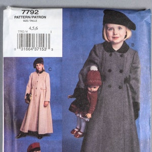 May include: A sewing pattern for a child's coat. The pattern includes three different styles: a red coat, a beige coat, and a grey coat. The pattern is for sizes 4, 5, and 6. The pattern is from Vogue for Me.