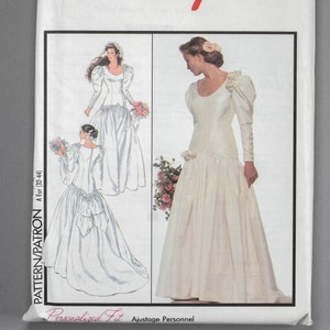 May include: A vintage sewing pattern for a wedding dress. The pattern is for sizes 6-18 and includes two different styles of dresses. The pattern is called "Style" and has the number 1887 on it.