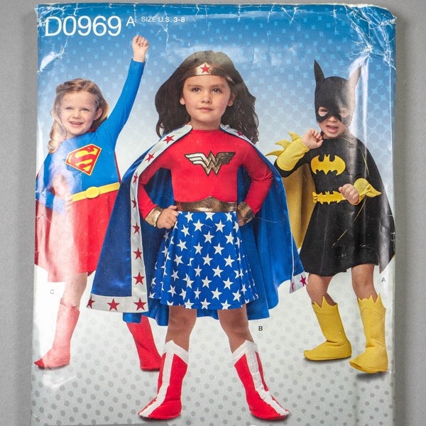 D0969 / S1035 | sz 3-8 | Simplicity 1035 Childs Toddlers Girls DC Superhero Costume Pattern: Wonder Woman, Batgirl, Supergirl Dress Cape