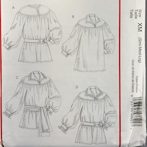 May include: A McCall's Costumes sewing pattern envelope, M4862, size XM. The front features black and white line drawings of four variations of a long-sleeved tunic with gathered yokes and cuffs, labeled A, B, C, and D, with a yellow header.