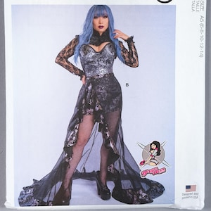 Peut inclure: Patron de couture McCall's Costumes M8229, taille A5 (6-8-10-12-14). L'enveloppe présente un modèle portant un corsage noir et argenté avec des manches longues en dentelle, une jupe asymétrique avec un voile transparent et le logo Yaya Han.