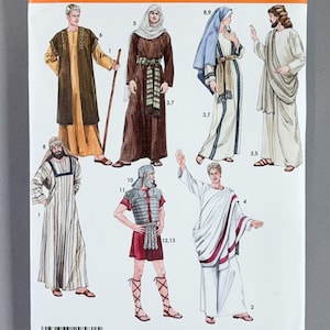May include: Simplicity sewing pattern 4213 for costumes in sizes XS-XL. The envelope features illustrations of six figures in historical-style garments, including tunics, robes, a Roman soldier outfit, and a toga, with numbered reference labels.